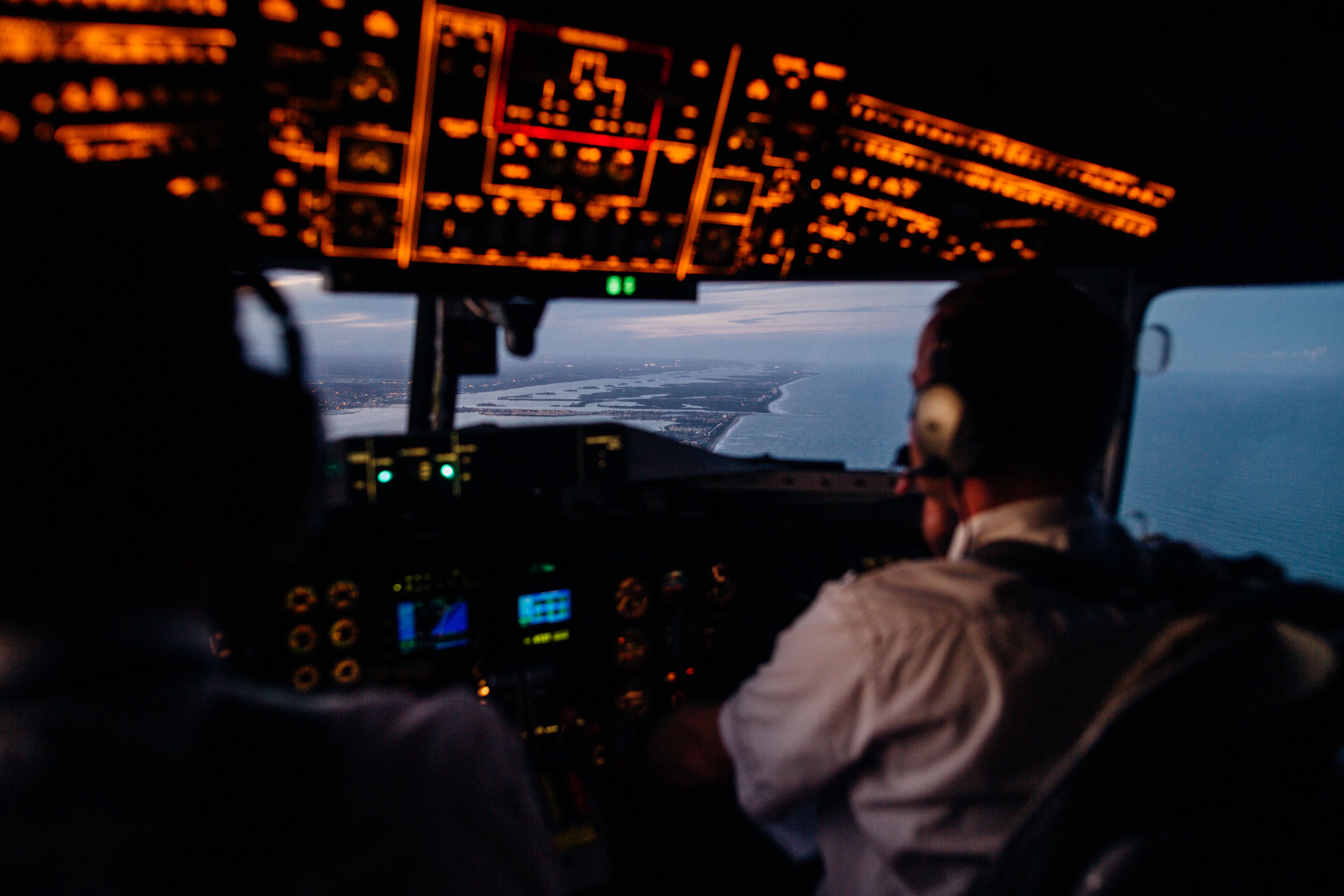 Commercial aircraft cockpit at dusk